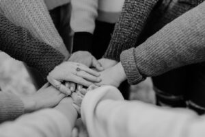 Black and white hands in a circle